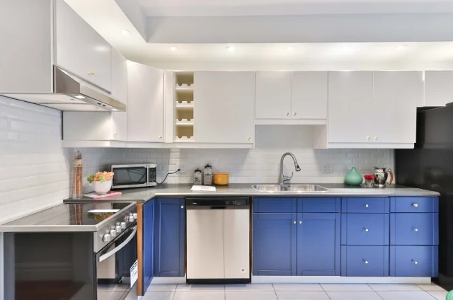 best home interior design with Blue and white L-shaped modular kitchen
