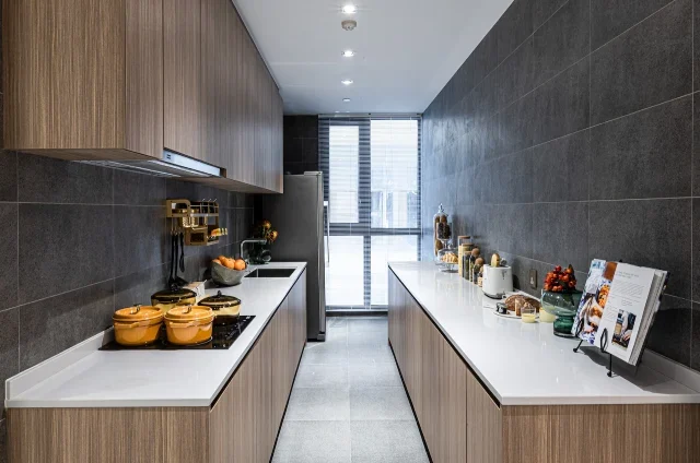 best interior designer in chennai designed Modular parallel kitchen interior with a brown cabinet and white table top