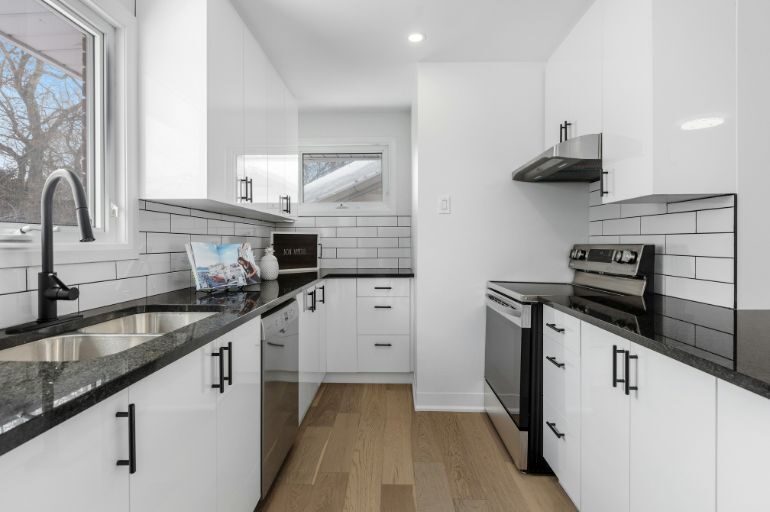 Blacka and white Parallel shaped kitchen in chennai